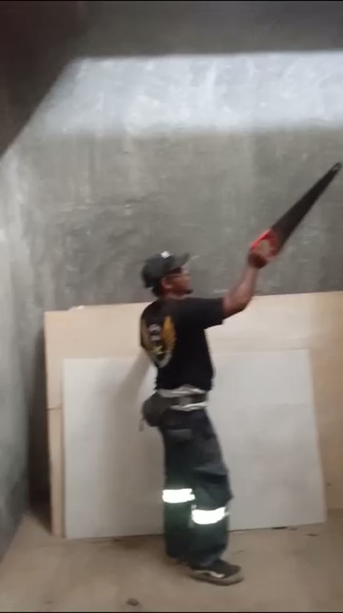 A Team Rio Walet Sumbawa worker fitting out the interior of a swiftlet house